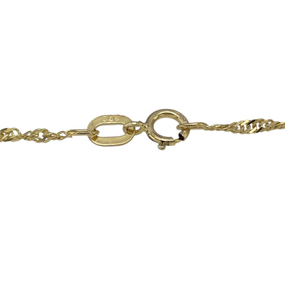 Bring delicate detail and subtle sparkle to your collection with this pre-owned 9ct yellow gold Singapore and ball link bracelet—a refined piece perfect for everyday elegance.

Design: The bracelet features a 7-inch Singapore chain interspersed with polished 3mm gold balls, creating light-catching movement and texture.
Material: Made from 9-carat yellow gold, the polished finish enhances both the twisted chain design and the shine of the beads.