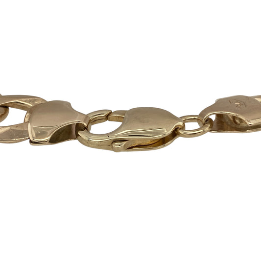 Bring bold luxury and striking style to your collection with this pre-owned 9ct yellow gold curb bracelet, a heavyweight piece with timeless presence.

Design: The bracelet measures 9 inches in length with substantial 12mm wide curb links, creating a strong and commanding look.
Material: Made from 9-carat yellow gold, the polished finish enhances the bold link design and adds rich warmth.