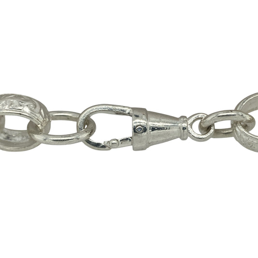 Bring bold sophistication and modern texture to your collection with this new 925 solid silver patterned belcher bracelet, a statement piece with striking detail.

Design: The bracelet measures 9 inches in length with 11mm wide alternating plain and patterned links, creating a distinctive and eye-catching look.
Material: Made from solid 925 sterling silver, the polished finish enhances the contrast between the plain and patterned links for a refined appearance.
