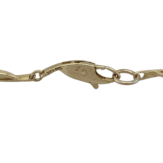 Bring understated luxury and timeless sophistication to your collection with this pre-owned 9ct yellow gold diamond chain-style necklace—a refined design that combines elegance with everyday wearability.

Design: The necklace features a classic chain style adorned with five sparkling diamonds delicately set between the links, adding subtle brilliance and a touch of glamour. The balanced placement of the diamonds creates a graceful flow and refined sparkle.