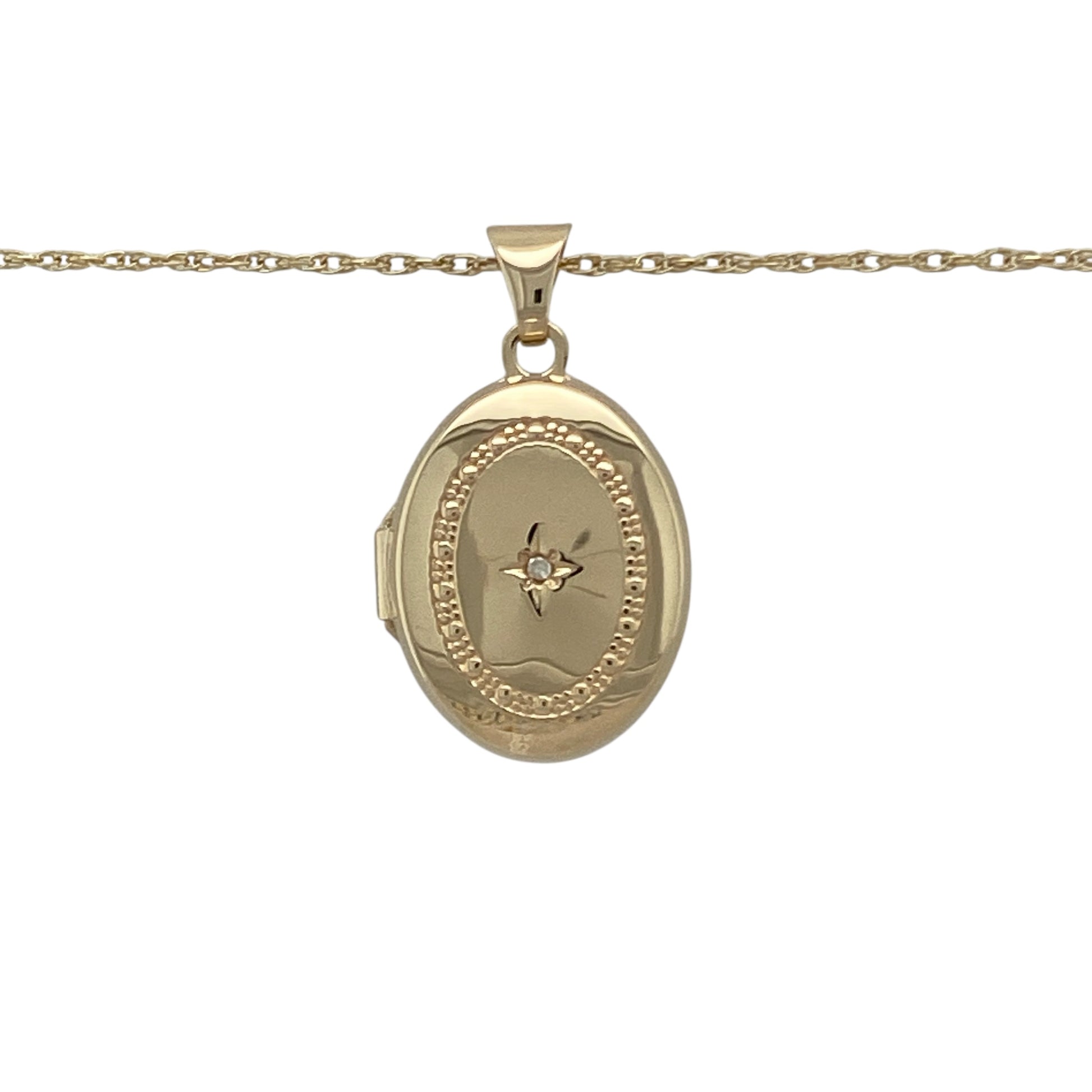 Bring sentiment, sparkle, and classic charm to your collection with this pre-owned 9ct yellow gold diamond oval locket pendant on an 18" Prince of Wales chain necklace—a timeless design perfect for keeping cherished memories close.

Design: The locket features an elegant oval shape with a textured surround accented by sparkling diamonds, adding depth and sophistication to its polished finish.