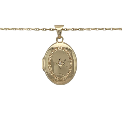 Bring sentiment, sparkle, and classic charm to your collection with this pre-owned 9ct yellow gold diamond oval locket pendant on an 18" Prince of Wales chain necklace—a timeless design perfect for keeping cherished memories close.

Design: The locket features an elegant oval shape with a textured surround accented by sparkling diamonds, adding depth and sophistication to its polished finish.