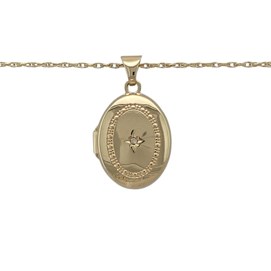 Bring sentiment, sparkle, and classic charm to your collection with this pre-owned 9ct yellow gold diamond oval locket pendant on an 18" Prince of Wales chain necklace—a timeless design perfect for keeping cherished memories close.

Design: The locket features an elegant oval shape with a textured surround accented by sparkling diamonds, adding depth and sophistication to its polished finish.