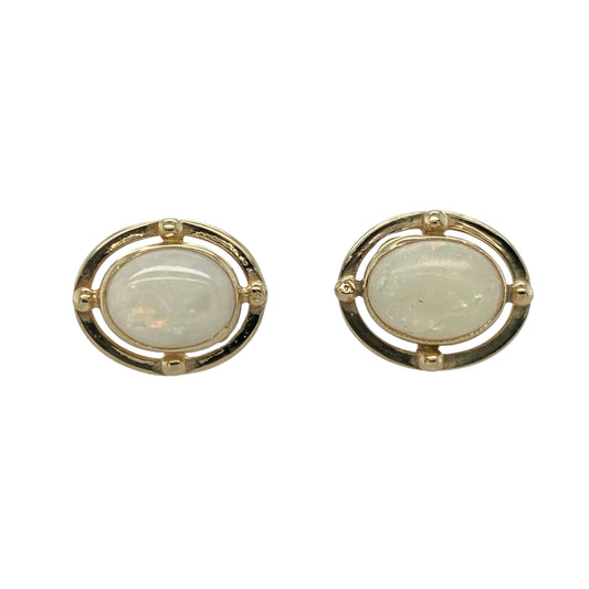 Bring iridescent beauty and classic elegance to your jewellery collection with these pre-owned 9ct yellow gold and oval opalique set stud earrings—perfect for adding timeless charm to any occasion.

Design: Each earring features a captivating 9mm by 7mm oval opalique stone, displaying shimmering flashes of colour that shift beautifully in the light. The smooth setting enhances the stone’s luminous finish and elegant shape.