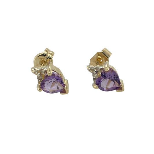 Bring romantic colour and subtle sparkle to your look with these pre-owned 9ct yellow gold diamond and amethyst set heart stud earrings—perfect for adding a touch of feminine elegance to any occasion.

Design: Each earring features a 5mm heart-shaped amethyst, radiating rich purple tones that symbolise love and calm. A delicate diamond accent adds sparkle above each stone, enhancing the romantic design.