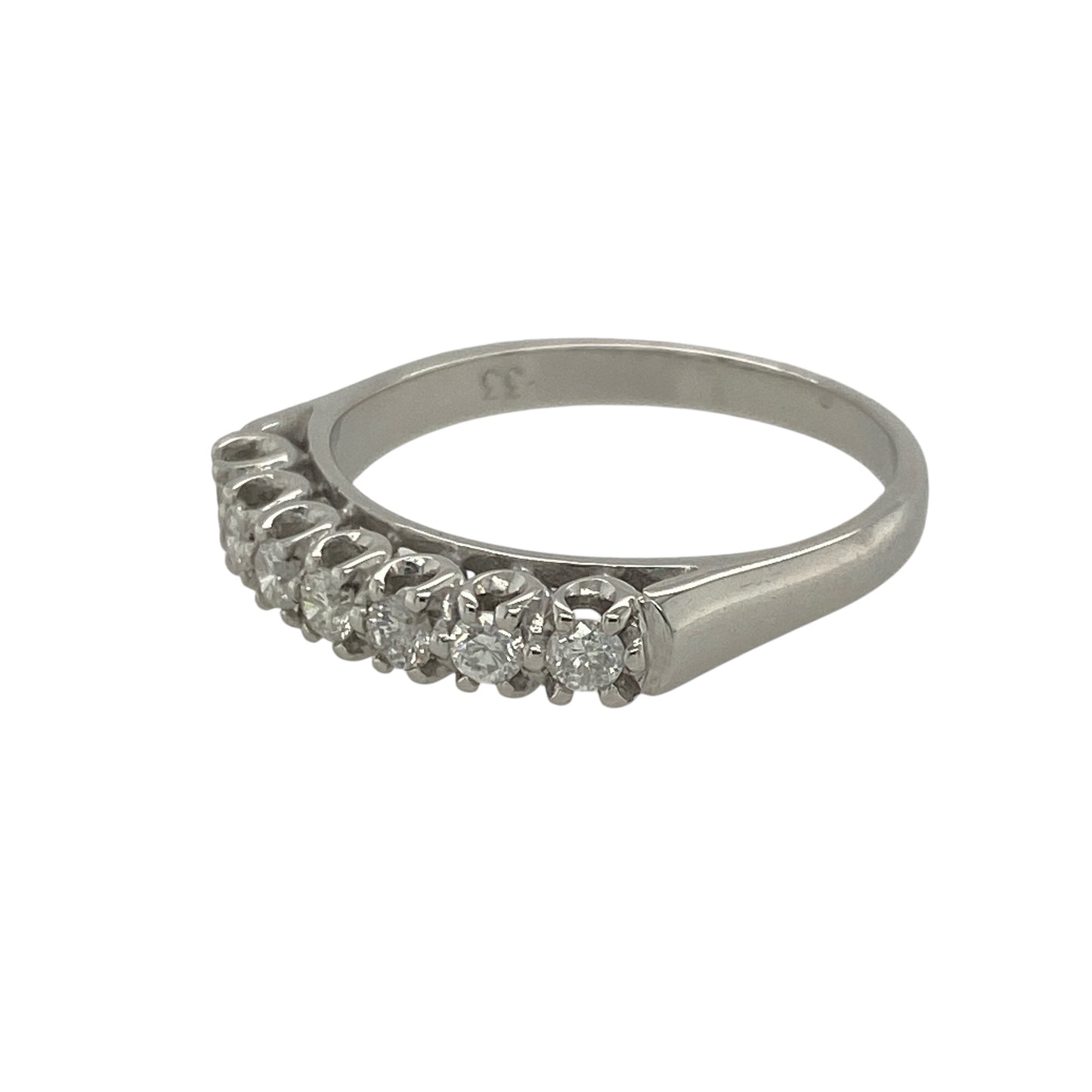 Pre-owned 18ct White Gold &amp; Diamond Set Band Ring in size P with the weight 3.60 grams. There are seven brilliant cut diamonds in the band at approximately 0.33ct of diamond content set in total