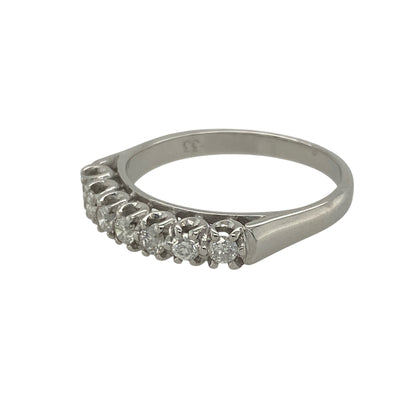 Pre-owned 18ct White Gold &amp; Diamond Set Band Ring in size P with the weight 3.60 grams. There are seven brilliant cut diamonds in the band at approximately 0.33ct of diamond content set in total