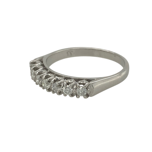 Pre-owned 18ct White Gold &amp; Diamond Set Band Ring in size P with the weight 3.60 grams. There are seven brilliant cut diamonds in the band at approximately 0.33ct of diamond content set in total