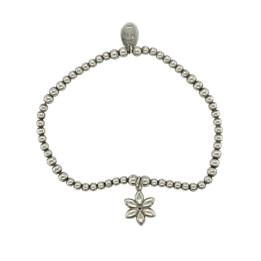 Add soft elegance and natural beauty to your collection with this pre-owned 925 silver and 9ct rose gold Clogau beaded stretchy bracelet, featuring a delicate floral charm for a touch of timeless femininity—perfect for everyday wear or gifting.

Design: The bracelet is composed of polished silver beads with a 12mm diameter flower charm set with shimmering mother of pearl, capturing a gentle iridescence that reflects the light beautifully.