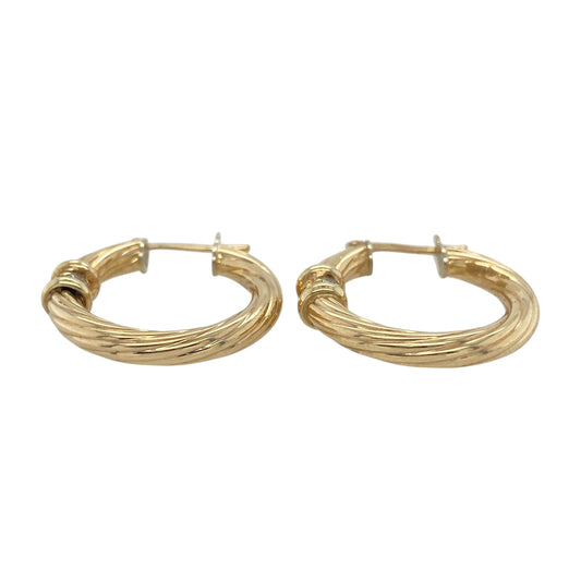 Add sparkle and sophistication to your collection with these pre-owned 9ct yellow gold and cubic zirconia twisted hoop creole earrings, combining timeless elegance with a modern touch—perfect for both everyday wear and special occasions.

Design: Each earring features a stylish twisted hoop design adorned with sparkling cubic zirconia stones, adding brilliance and texture from every angle.
 