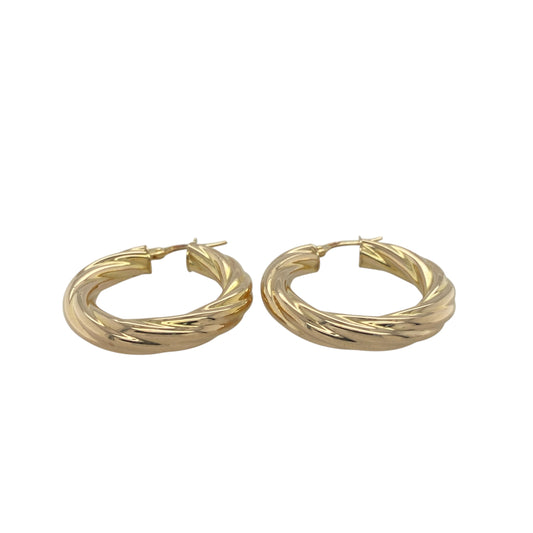 Add timeless elegance and graceful movement to your collection with these pre-owned 9ct yellow gold twisted hoop creole earrings, offering classic style with a refined twist—perfect for everyday wear or special occasions.

Design: Each earring features a beautifully twisted hoop design that reflects light from every angle, adding depth and subtle sparkle to a traditional silhouette.
