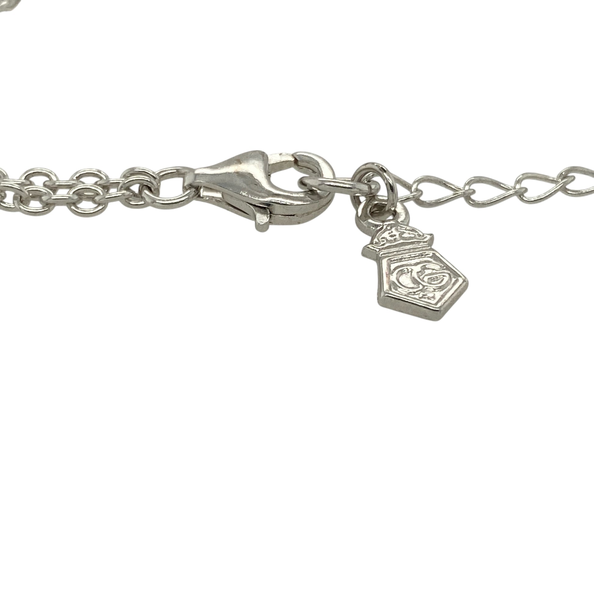 Bring symbolic beauty and delicate charm to your jewellery collection with this pre-owned 925 silver and 9ct rose gold Clogau daffodil bracelet — a graceful piece inspired by the national flower of Wales.

Design: The bracelet features a detailed daffodil motif in warm rose gold, paired with a fine silver chain for a light and elegant look.
Material: Made from 925 silver with 9ct rose gold detailing, the two-tone finish enhances the floral design and reflects classic Clogau styling.