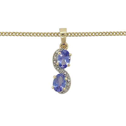 Bring elegant colour and refined sparkle to your jewellery collection with this pre-owned 9ct yellow gold diamond and tanzanite swirl pendant on an 18" curb chain — a graceful piece with flowing lines and vibrant brilliance.

Design: The pendant measures 2.4cm in length including the bail and features a stylish swirl design set with two 7mm by 5mm oval tanzanite stones, complemented by delicate diamonds for added sparkle and movement.