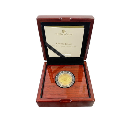 Bring historical significance and modern collectability to your collection with this 2023 UK £2 Edward Jenner Gold Proof Coin—an exceptional Royal Mint release presented in its official box with certification.

Design: One side features the definitive portrait of King Charles III, while the reverse showcases an Edward Jenner-themed design inscribed with “A Vaccine to End Smallpox”, commemorating his groundbreaking contribution to medical science.