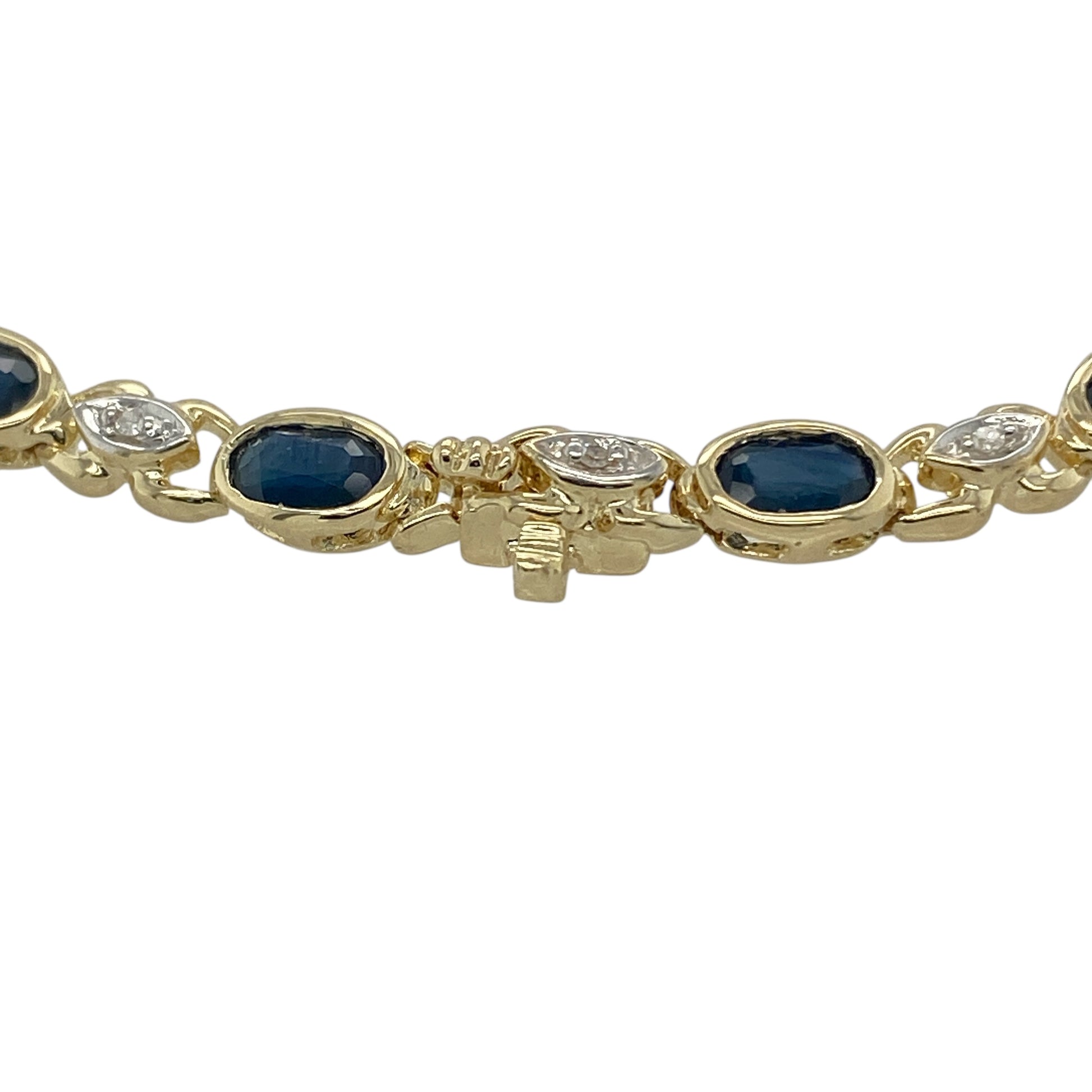 Bring timeless colour and refined sparkle to your jewellery collection with this pre-owned 9ct yellow gold diamond & sapphire set bracelet, offering classic elegance with a luxurious feel.

Design: The bracelet features a graceful line design, showcasing oval sapphires evenly spaced and accented with diamonds to create a balanced and sophisticated look.