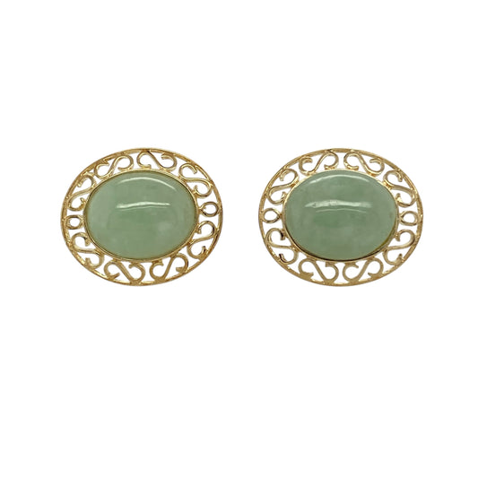 Bring soft colour and elegant detail to your jewellery collection with these pre-owned 9ct yellow gold & jade set oval stud earrings, offering classic design with refined character.

Design: The earrings feature oval jade centre stones framed by an open patterned surround, creating a delicate and decorative stud style.
Material: Made from 9-carat yellow gold, the warm polished finish beautifully complements the gentle green tones of the jade.