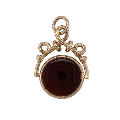 Bring distinctive vintage character and rich colour to your jewellery collection with this pre-owned 9ct rose gold bloodstone & carnelian set movable flippable fob pendant, offering timeless style with versatile wear.

Design: The pendant features a classic fob style with a rotating, flippable design, allowing either gemstone to be worn facing outward for two looks in one.