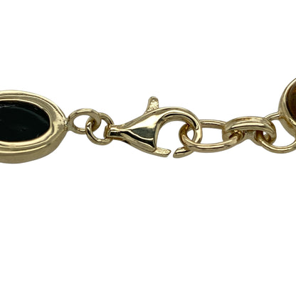 Bring warm colour and natural beauty to your jewellery collection with this pre-owned 9ct yellow gold & amber bracelet, offering striking presence and timeless appeal.

Design: The bracelet features a classic linked design set with rich amber stones, showcasing warm orange and yellow tones that create an eye-catching and elegant look.
Material: Made from 9-carat yellow gold, the warm polished finish beautifully complements the natural glow of the amber.