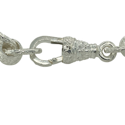 Bring bold shine and contemporary style to your jewellery collection with this new 925 silver patterned rollerball bracelet, offering standout design with a substantial feel.

Design: The bracelet features a striking rollerball link pattern, creating a modern and eye-catching look with strong visual texture.
Material: Made from solid 925 sterling silver, the polished finish delivers bright shine and lasting durability.