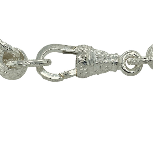 Bring bold shine and contemporary style to your jewellery collection with this new 925 silver patterned rollerball bracelet, offering standout design with a substantial feel.

Design: The bracelet features a striking rollerball link pattern, creating a modern and eye-catching look with strong visual texture.
Material: Made from solid 925 sterling silver, the polished finish delivers bright shine and lasting durability.