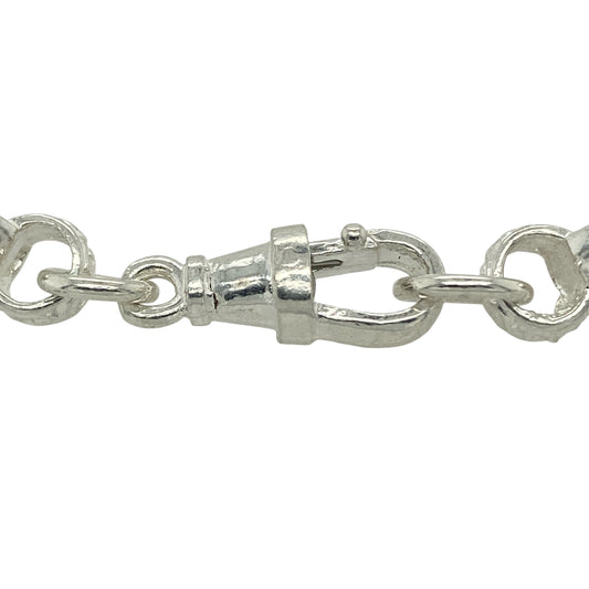 Bring romantic charm and modern shine to your jewellery collection with this new 925 silver & pink stone set double heart belcher bracelet, offering eye-catching design with a quality feel.

Design: The bracelet features a patterned belcher link design, finished with two interlinked heart motifs set with pink stones for a sweet and elegant focal point.
Material: Made from solid 925 sterling silver, the polished finish provides bright shine and lasting durability.