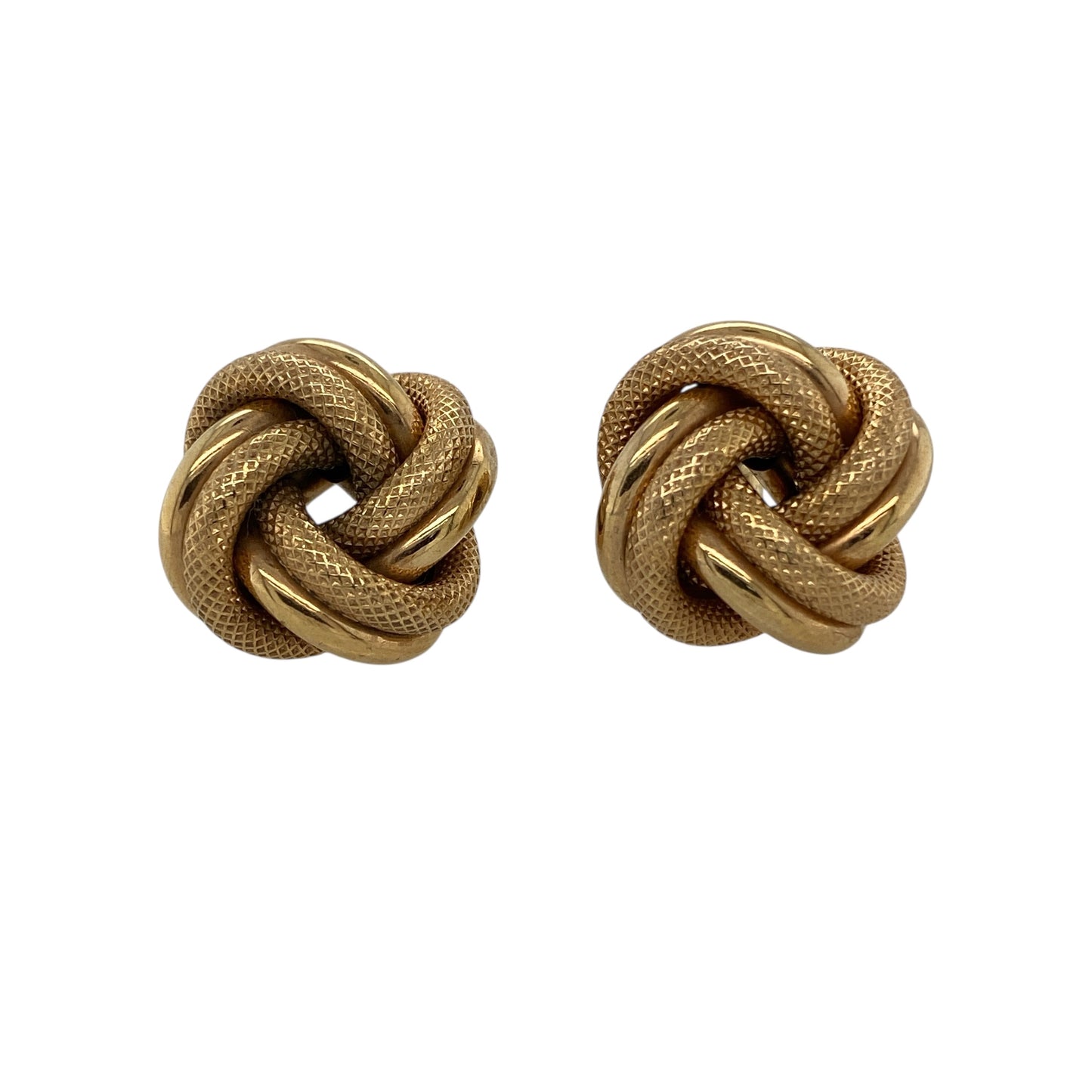 Bring bold texture and classic elegance to your jewellery collection with these pre-owned 9ct yellow gold large patterned knot stud earrings, a striking design that combines traditional symbolism with standout presence.

Design: The earrings feature a large knot motif with an engraved patterned finish, creating depth and visual interest. Measuring approximately 17mm in diameter, they offer a confident and eye-catching stud profile.