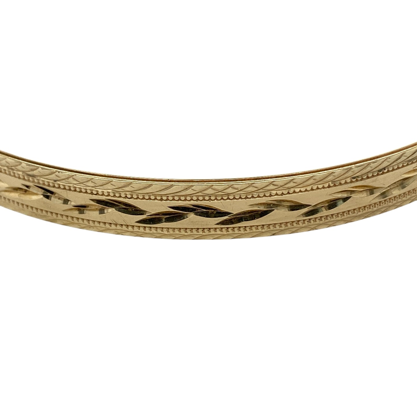 Bring classic elegance and timeless texture to your jewellery collection with this pre-owned 9ct yellow solid gold patterned bangle, a refined piece that combines traditional design with everyday versatility.

Design: The bangle features an all-over patterned finish, adding subtle texture and visual interest to its clean, solid profile. Measuring approximately 6.5mm in width, it offers a balanced and elegant presence on the wrist.