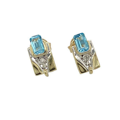 Bring elegant colour contrast and refined sparkle to your jewellery collection with these pre-owned 9ct yellow and white gold diamond & blue topaz set stud earrings, a timeless design with classic appeal.

Design: Each stud features a rectangular blue topaz stone measuring 5mm by 3mm, creating a clean and sophisticated focal point, accented with diamonds for added brilliance.