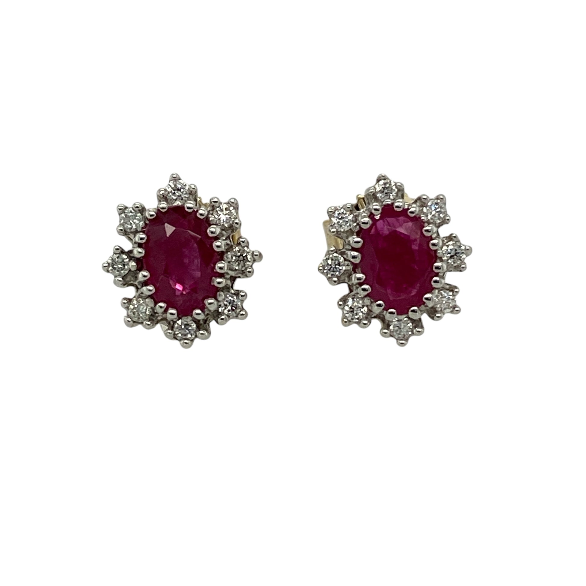 Bring rich colour and timeless sparkle to your jewellery collection with these pre-owned 9ct yellow gold diamond & ruby set cluster stud earrings, a classic design with elegant presence.

Design: Each stud features an oval ruby measuring 6mm by 4mm, forming a vibrant red focal point within a traditional cluster arrangement, accented with diamonds for added brilliance.