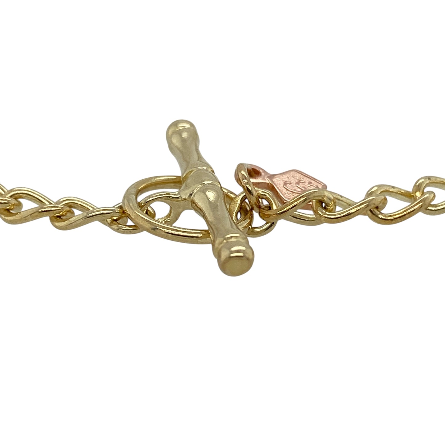 Bring timeless charm and elegant two-tone style to your collection with this pre-owned 9ct yellow and rose gold Clogau T-bar charm bracelet—an iconic piece perfect for showcasing your favourite charms.

Design: This 9" bracelet features polished 4mm links with a classic T-bar fastening, offering both security and traditional charm bracelet styling. The subtle mix of yellow and rose gold adds depth and warmth, giving the piece a distinctive Clogau character.