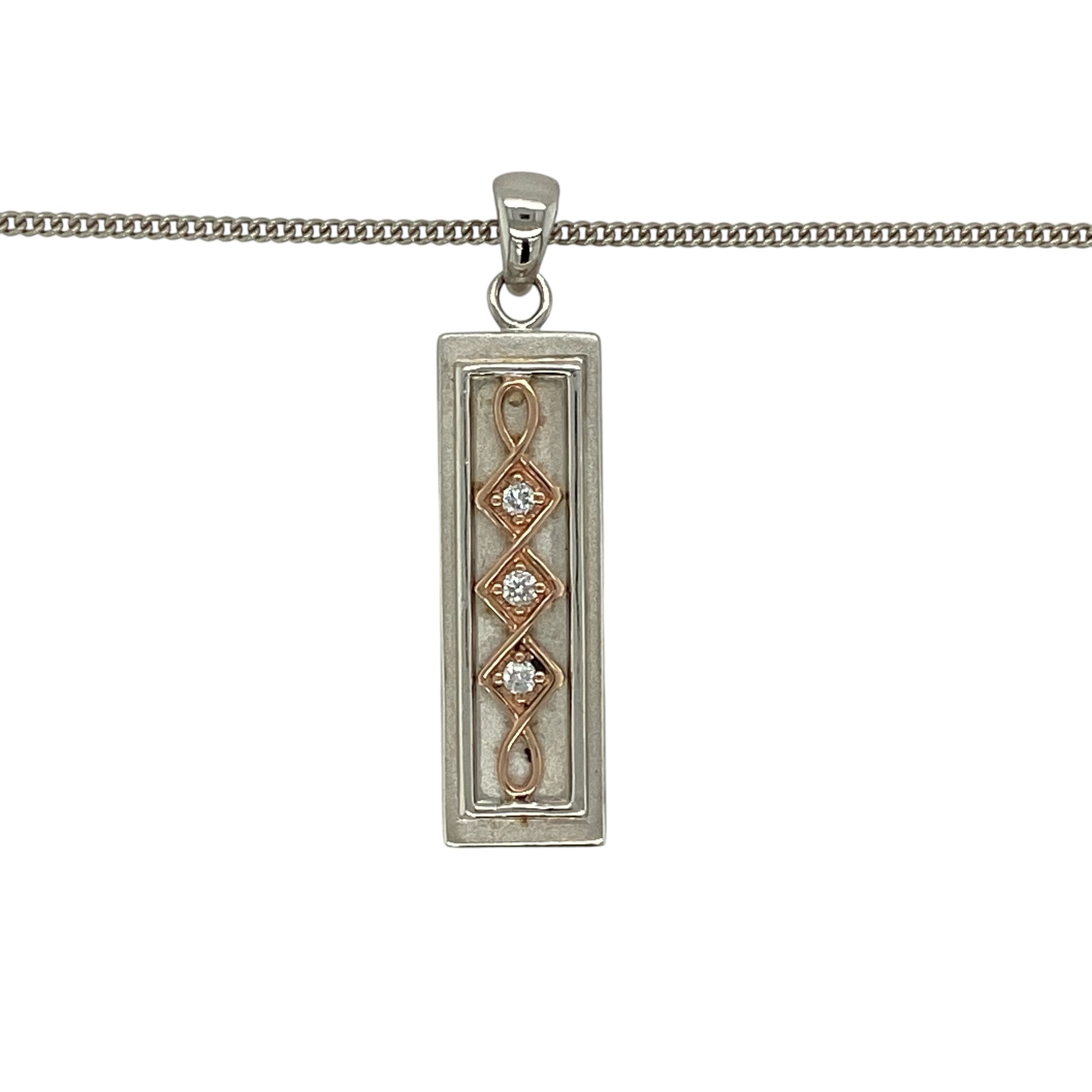 Bring refined simplicity and signature Welsh style to your jewellery collection with this pre-owned 925 silver diamond set Clogau ingot pendant necklace.

Design: The pendant features a sleek ingot-style design accented with a subtle diamond, measuring approximately 3.3cm in length including the bail for a clean and contemporary look.
Material: Made from sterling silver, the polished finish highlights the minimalist ingot form while allowing the diamond detail to add a touch of refined sparkle.