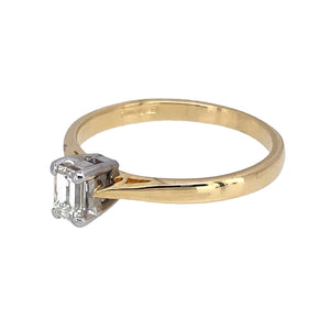 Preowned 18ct Yellow and White Gold & Diamond Set Solitaire Ring in size L with the weight 2.20 grams. The emerald cut diamond is approximately 25pt