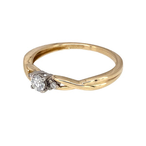 Preowned 9ct Yellow and White Gold & Diamond Set Solitaire Ring in size N with the weight 1.40 grams. The brilliant cut center diamond is approximately 20pt with two smaller diamonds either side