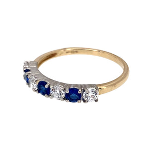 Preowned 9ct Gold & Blue and White Cubic Zirconia Set Band Ring in size P with the weight 1.60 grams. The stones are each 3mm diameter