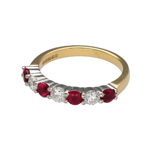 Preowned 18ct Yellow and White Gold Diamond & Ruby Set Band Ring in size M with the weight 4 grams. The ruby stones are each 3mm diameter. There are three diamond stones are each 14pt with approximate clarity Si2 and colour K - M. There is approximately 42pt of diamond content in total