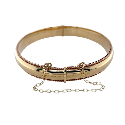 Bring elegance, heritage, and timeless craftsmanship to your collection with this pre-owned 9ct yellow and rose Cymru Welsh gold hinged bangle—a beautifully detailed piece inspired by classic design and Welsh tradition.

Design: The bangle features an intricate rope-style pattern that flows seamlessly around the wrist, highlighted by the soft contrast of yellow and rose gold tones. Its hinged design ensures both style and practicality, offering ease of wear and a secure fit.