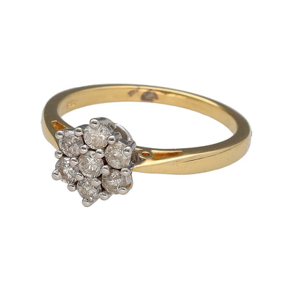 Preowned 18ct Yellow and White Gold & Diamond Set Cluster Ring in size N to O with the weight 3.60 grams. The front of the ring is 9mm high and it is made up of seven small brilliant cut diamonds