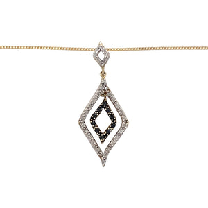 Preowned 9ct Yellow and White Gold White and Black Diamond Set Pendant on an 18" fine curb chain with the weight 2.60 grams. The pendant is 3.4cm long 
