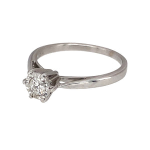 Preowned 9ct White Gold & Diamond Illusion Set Solitaire Ring in size L with the weight 1.70 grams. The diamond is approximately 15pt