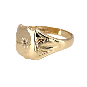Preowned 9ct Yellow Gold & Diamond Set Chester Hallmark Antique Shield Signet Ring in size Q with the weight 4 grams. The front of the ring is 12mm high