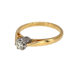 Preowned 18ct Yellow and White Gold & Diamond Set Solitaire Ring in size K with the weight 2.20 grams. The diamond is approximately 10pt with approximate clarity Si and colour K - M