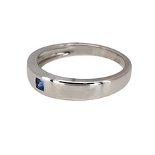 Load image into Gallery viewer, Preowned 9ct White Gold &amp; Sapphire Set Band Ring in size L with the weight 2.50 grams. The front of the band is 4mm wide and the sapphire stone is 2mm by 2mm
