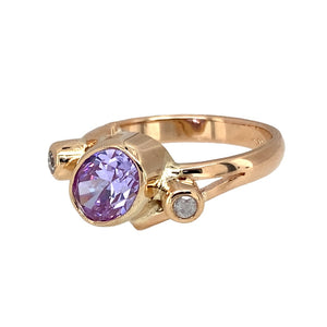 Preowned 14ct Yellow Gold & Purple and White Cubic Zirconia Dress Ring in size L with the weight 3.70 grams. The pink stone is 7mm by 5mm