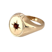 Load image into Gallery viewer, Preowned 9ct Yellow Gold &amp; Garnet Set Oval Signet Ring in size U with the weight 6.90 grams. The front of the ring is 16mm high and the garnet stone is approximately 4mm diameter
