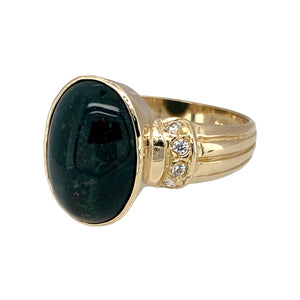 Preowned 9ct Yellow Gold Bloodstone & Cubic Zirconia Cabochon Set Ring in size P with the weight 4.40 grams. The bloodstone is 14mm by 10mm