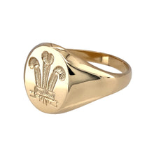 Load image into Gallery viewer, New 9ct Yellow Gold Three Feather Oval Signet Ring in size S with the weight 6 grams. The front of the ring is 14mm high
