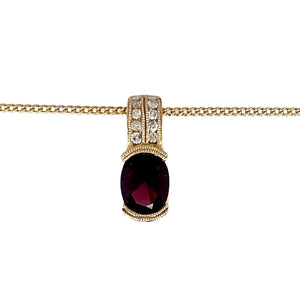 Preowned 9ct Yellow Gold Diamond & Pink Tourmaline Set pendant on an 18" curb chain with the weight 4.70 grams. The pendant is 19mm long and the pink tourmaline stone is 9mm by 7mm