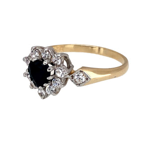 Preowned 9ct Yellow and White Gold Sapphire & Cubic Zirconia Set Heart Cluster Ring in size N with the weight 2.10 grams. The sapphire stone is approximately 5mm diameter