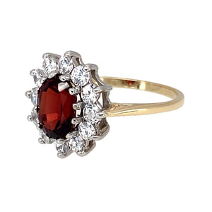 Preowned 9ct Yellow and White Gold Garnet & Cubic Zirconia Set Cluster Ring in size M with the weight 2.40 grams. The garnet stone is 8mm by 6mm