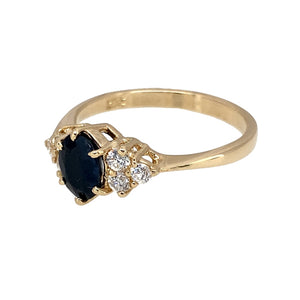 Preowned 9ct Yellow Gold Sapphire & Cubic Zirconia Set Dress Ring in size N with the weight 2.30 grams. The sapphire stone is 7mm by 5mm
